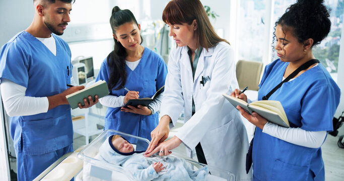 Doctor, nurses and infant CPR on mannequin for medical simulation, demonstration or rescue notes. People, health interns and pediatrician with doll in clinic for baby chest compressions and technique
