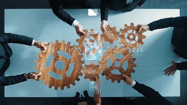 A diverse business team engages in collaborative cybersecurity planning, utilizing digital gears and technology concepts in a professional office setting, focusing on innovative solutions. Raster