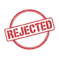 A circular red stamp boldly declares the word rejected in white letters