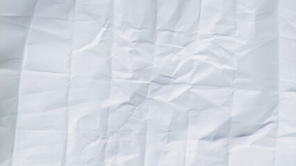Folded white paper sheet with crumpled and wrinkled texture. Clean paper background pattern with...