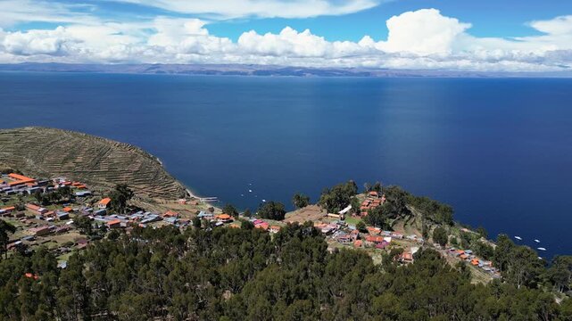 Isla del Sol, Bolivia: Aerial drone footage of the Yumani village in the Isla del sol on the lake titicaca in the Andes in the Bolivia. Shot with an orbit motion at the edge of the island with the jet