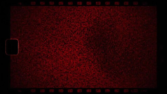 Vintage film grain and static overlay in deep red hues with evolving light patterns