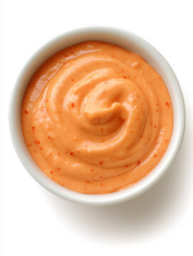 A vibrant red chipotle mayo in a smooth bowl highlights its creamy texture and color Generative AI