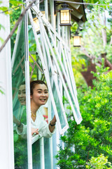 Obraz premium Asian young woman walking in a japanese garden