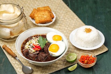 Rawon is a typical Indonesian dish originating from Ponorogo, East Java, which is a black meat soup with a mixture of special spices using kluwek.
