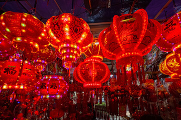 Red lanterns and various decorations sold in chinese market in Glodok, Jakarta, Indonesia for lunar new year © HaniSantosa