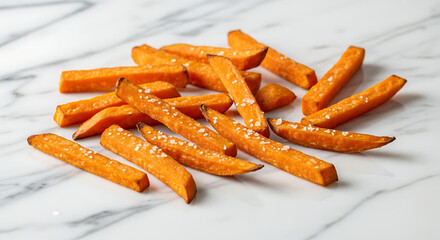 Crispy sweet potato fries on marble surface