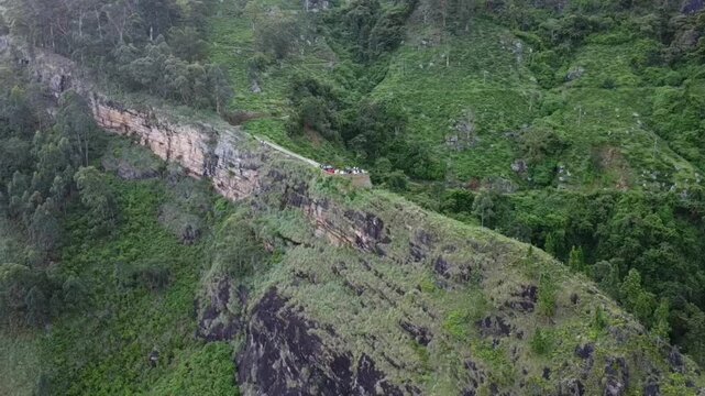 Cinematic drone footage of Backer&rsquo;s Bend, Sri Lank captured from a distance with a smooth orbit shot, showcasing the winding surrounding landscape. Perfect for travel films, documentaries, and scenic 