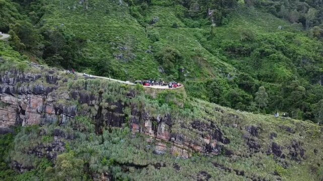 Cinematic drone footage of Backer&rsquo;s Bend, Sri Lanka, captured with a close orbit shot. The smooth drone shot moving through the clouds.