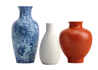 Three vases, blue, white, and orange, against black, in a still-life arrangement