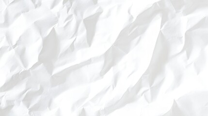 Obraz premium A close-up of crumpled white paper, showcasing a textured surface with soft shadows and highlights that create a dynamic visual effect.