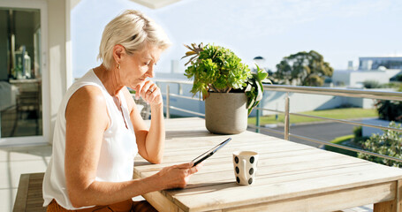 Obraz premium Balcony, coffee and thinking with mature woman at apartment for break, decision or social media. Home, reading or relax and female person with beverage outdoor for fresh air, me time or planning