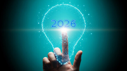 A hand touching a glowing lightbulb with the year 2026 written inside it