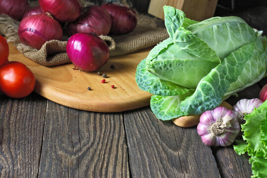 Assorted Fresh Vegetables on Wooden Cutting Board