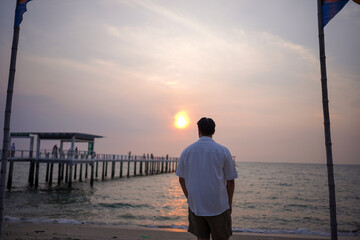 man walking on the beach