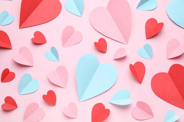 Composition with different paper hearts on pink background. Valentine's Day celebration