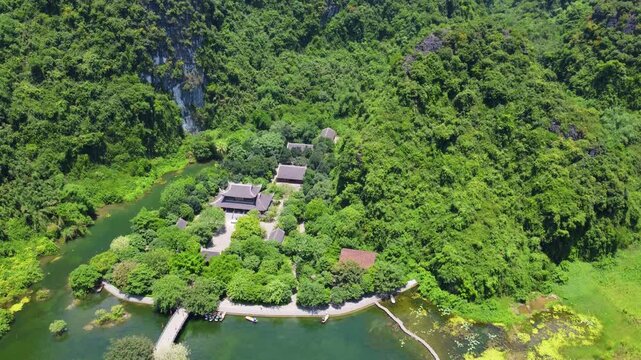 Aerial pan up at ancient temple in Trang An, Vietnam