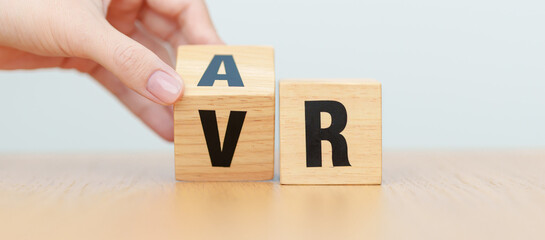 hand change wooden block from VR to AR, VIRTUAL and AUGMENTED REALITY, MR, Mixed Reality, XR, Extended, Metaverse and Immersive Technology concept