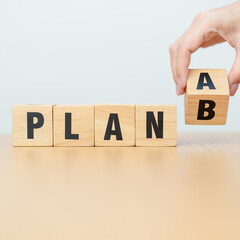 hand change wooden block PLAN A to PLAN B. strategy, leadership, management, marketing, project and...