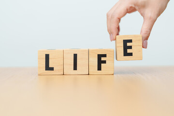 hand change wooden block Live to Life. Lifestyle, Live your life, learning, motivation and mindset concepts