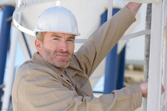a male builder is outdoors