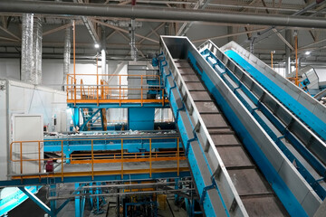 Conveyor lines waste sorting plant workshop. Selection and sorting for further sale for recycling plant factory