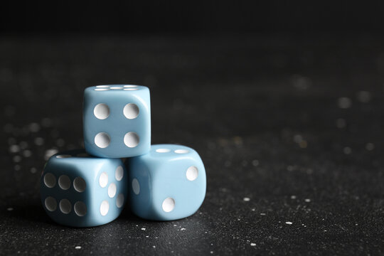 Blue dices on dark background