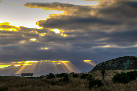 Golden crepuscular rays over Kaikoura Peninsula