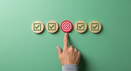 Fototapeta premium A hand pointing to a target among checkmarks on wooden pieces
