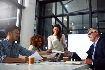 People, meeting and documents in office at night with finance report, data analysis and profit. Mature man, staff and paperwork for sales growth, financial graphs and overtime for performance metrics