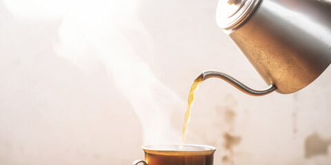Hot coffee pouring from a metal kettle into a cup, creating steam against a bright background, representing morning and slow living