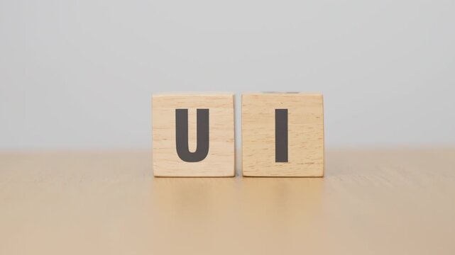 hand change wooden block from UI to UX. User Interface and User Experience, Usability, Information Architecture, IA, Research, Prototype, Testing, Onboarding, Design Thinking and Wireframe concepts