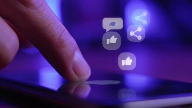 Close up of finger scrolling on smartphone with floating social media reaction icons like heart comment and share in purple neon lighting.