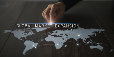 business growth expansion optimization concept. A hand points at a world map, illustrating the concept of global market expansion.