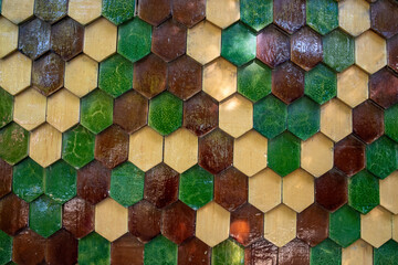 Hexagonal facade forming a multicolored geometric pattern