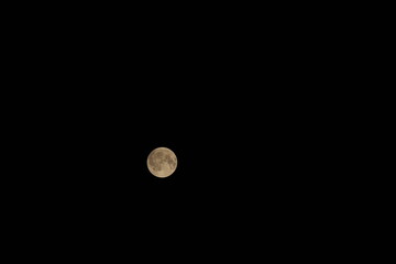 Full moon glowing in dark night sky © EDUARDOIVAN