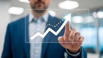 Man in suit touching upward trending graph on transparent screen