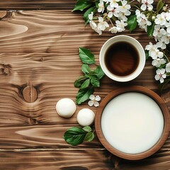 Fototapeta premium White Milk, Tea, and Blossoms on Wooden Table
