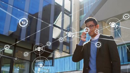 Animation of icons connecting with lines over businessman talking on phone outside office - Powered by Adobe