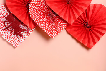 Naklejka premium Happy Valentine's Day concept. Festive border of red and patterned paper hearts for a Valentine's Day card.