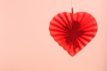 Naklejka premium Happy Valentine's Day concept. Red paper heart with a Cupid silhouette, perfect for a minimalist design.