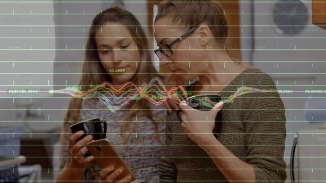 Animation of graphs and numbers over caucasian coworkers discussing over phone during coffee break