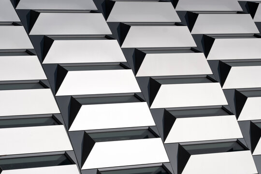 Modern architecture abstract tiles pattern on white facade showing depth and geometry structure for clean contemporary exterior background