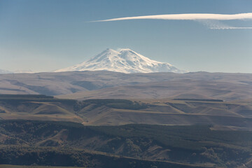 View of Elbrus mount and the foothills at sunny autumn day