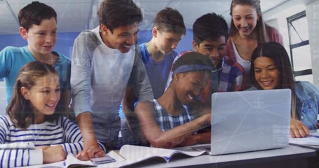 Animation of graphs and globe over diverse students watching project on laptop at school - Powered by Adobe