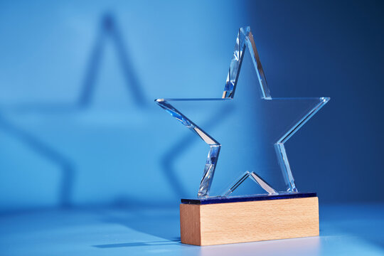star shape trophy against blue background