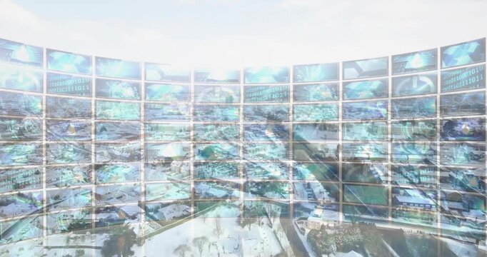 Curved wall of digital screens displaying cityscape and binary code animation