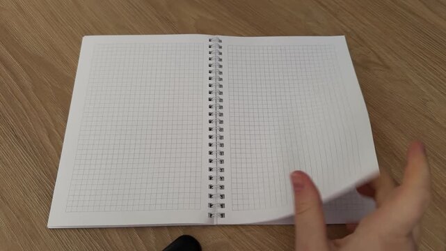 Blank Grid Notebook on Wooden Desk for Creative Projects