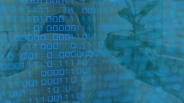 Animation of binary coding data processing over glowing computer circuit board