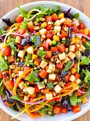Colorful salad, tossed greens, diverse toppings, vibrant presentation,  lunch,  vegetarian